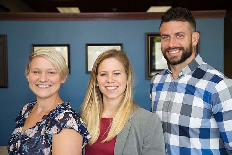 Chiropractors Crystal Lake IL Josh Young and Emily Schultz with Staff
