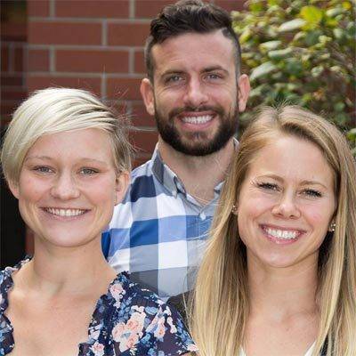 Chiropractors Crystal Lake IL Josh Young and Emily Schultz with Staff